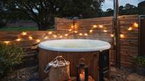 The bubbling hot tub, perfectly secluded, is a welcoming sight for tired limbs after a day's walking