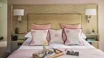Swathed in luxurious linens, sumptuous bedding and pretty throws and cushions, you're guaranteed a blissful nights' sleep...