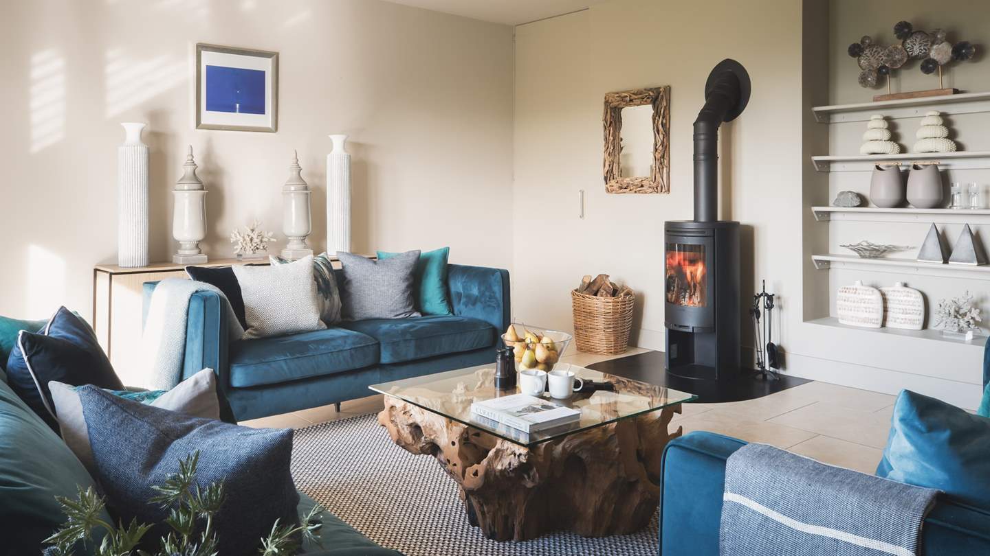 The sitting room is gorgeously chic in shades of blues and creams