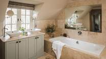The master en suite, complete with bath tub for two...