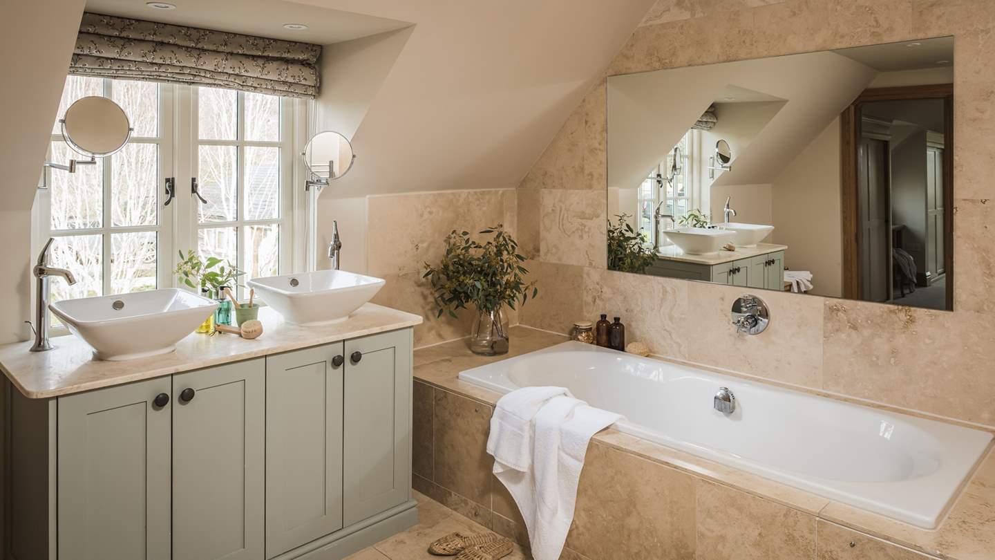 The master en suite, complete with bath tub for two...
