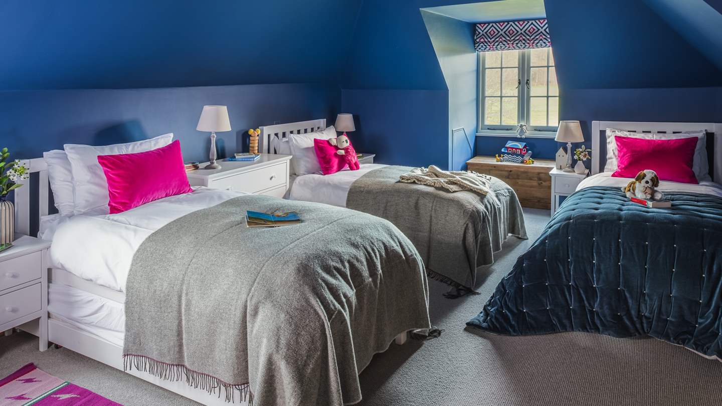 The fifth bedroom – in blues and pinks - is just perfect for little ones and has three single beds plus a trestle bed should you need it