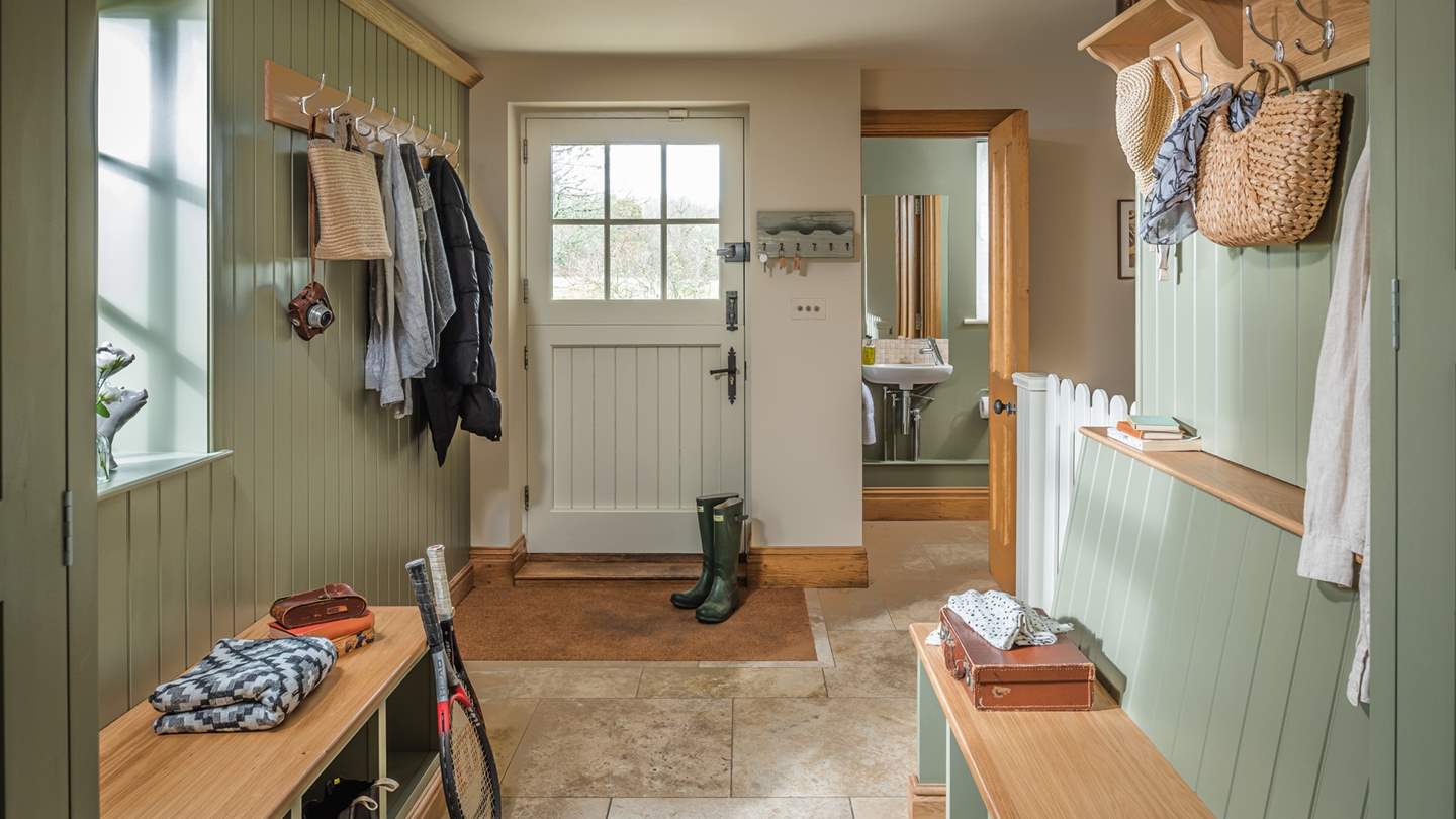 The boot room with plenty of hooks and boot storage - plus room for a wet dog!