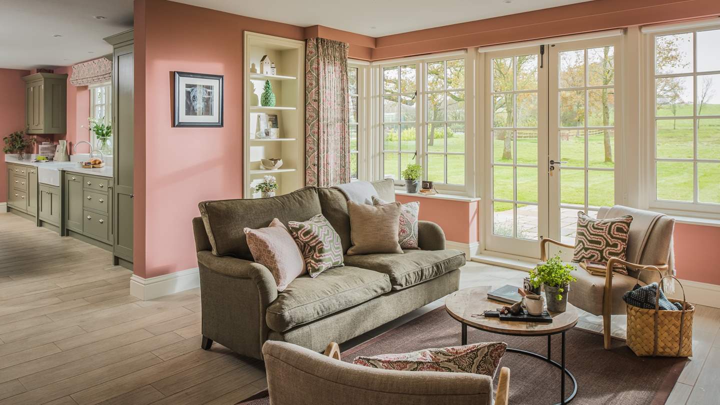Beautiful double doors lead out into the garden, just perfect on a warm summers day