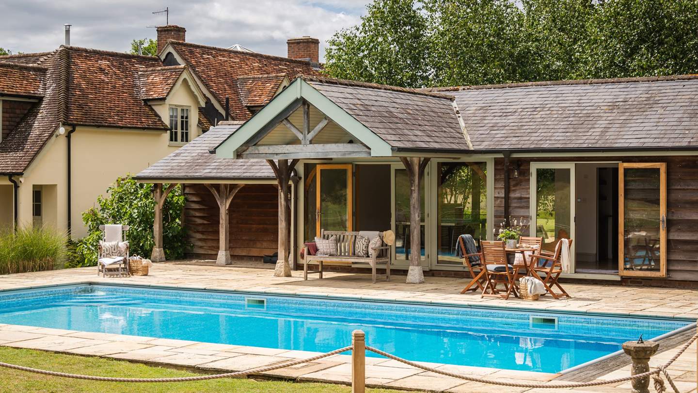 Step into the garden and you’ll discover a blissful space in which to relax, complete with a heated outdoor swimming pool 