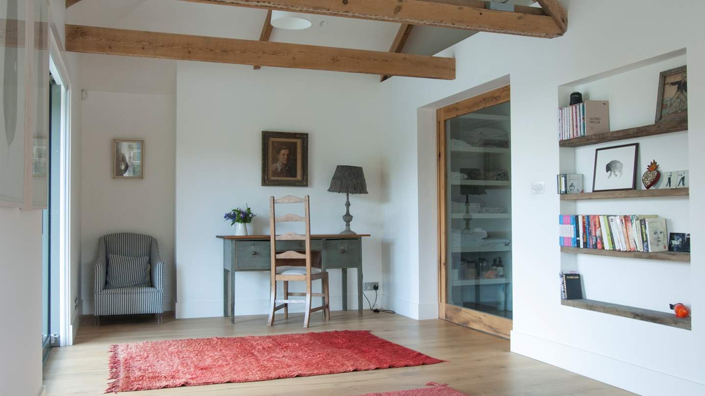 Two sets of doors lead onto a glass balcony so you can watch the tide ebb and flow
