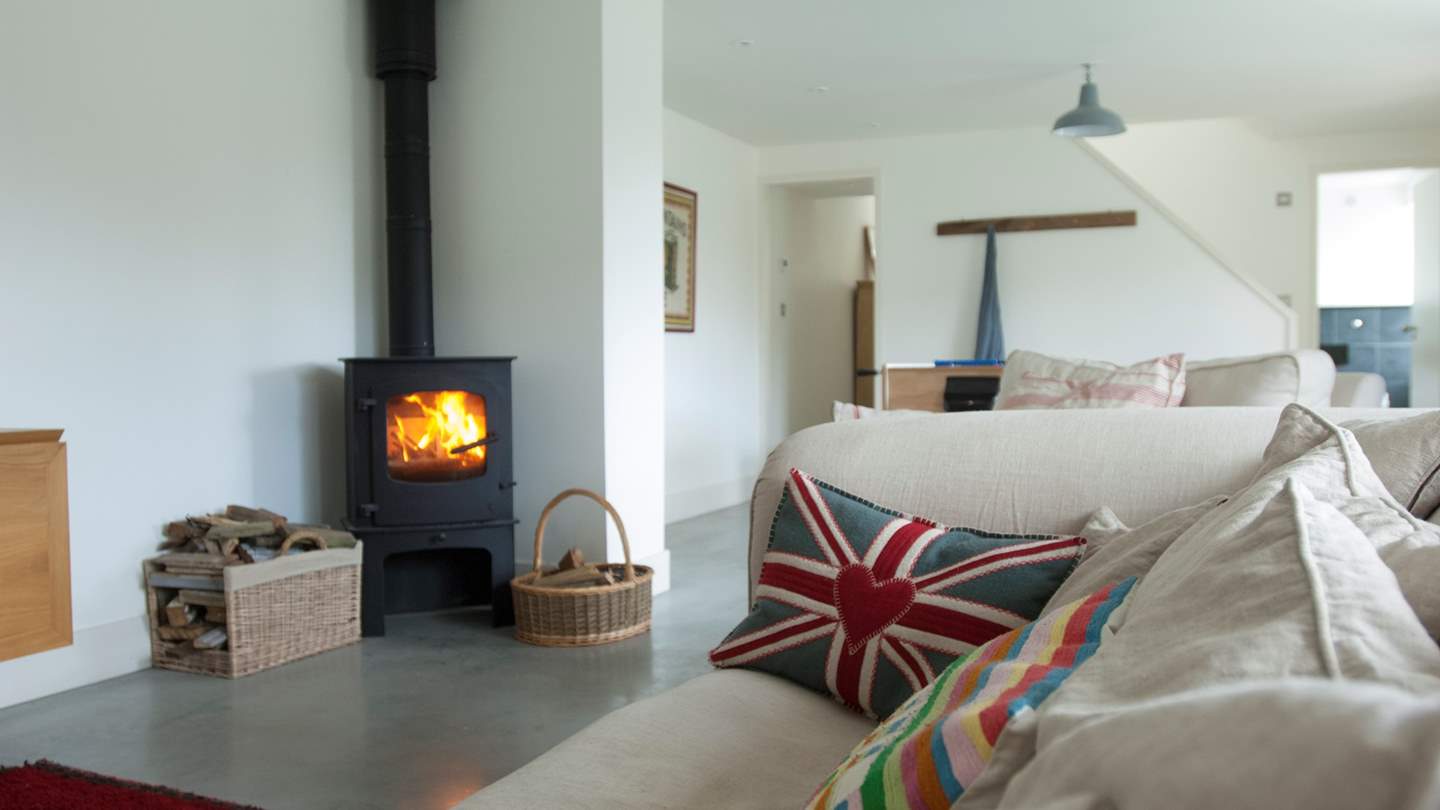 The relaxed living area with ground floor bedroom and WC beyond