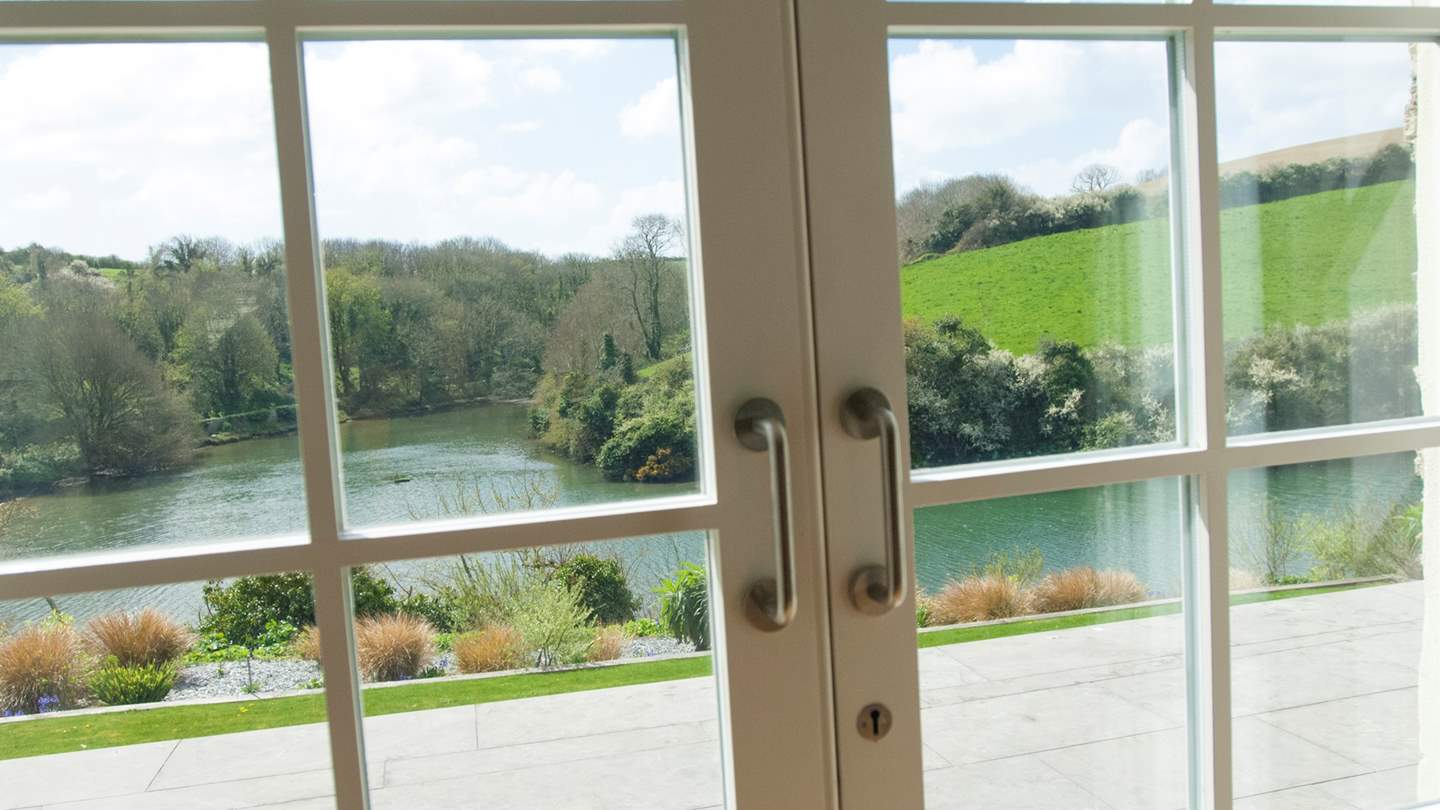 Doors lead out onto the terrace and garden below
