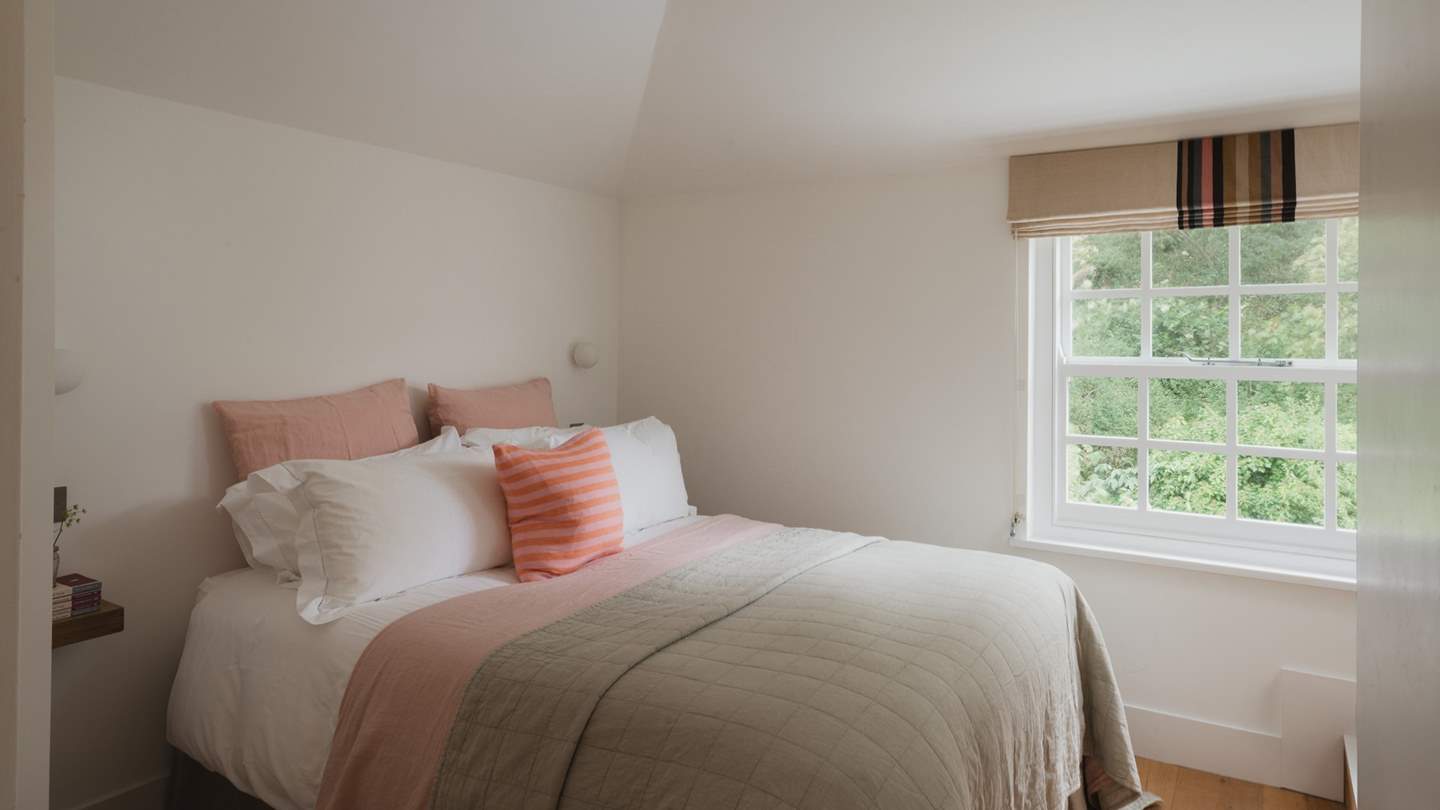 Soft pink hues dress the third bedroom, and completes our retreats calm elegance