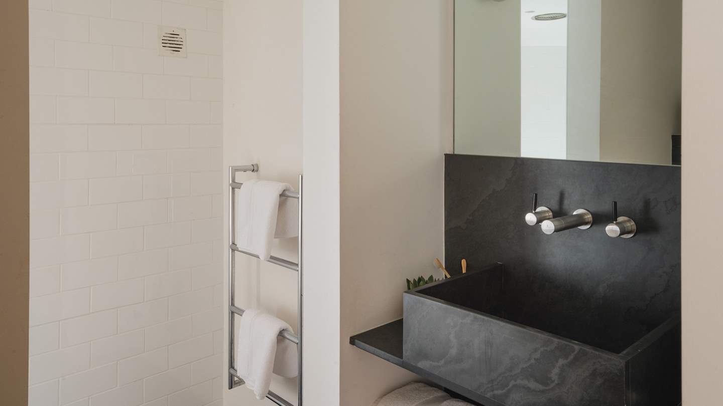 A separate en suite perfect for self-care rituals completes this bedroom