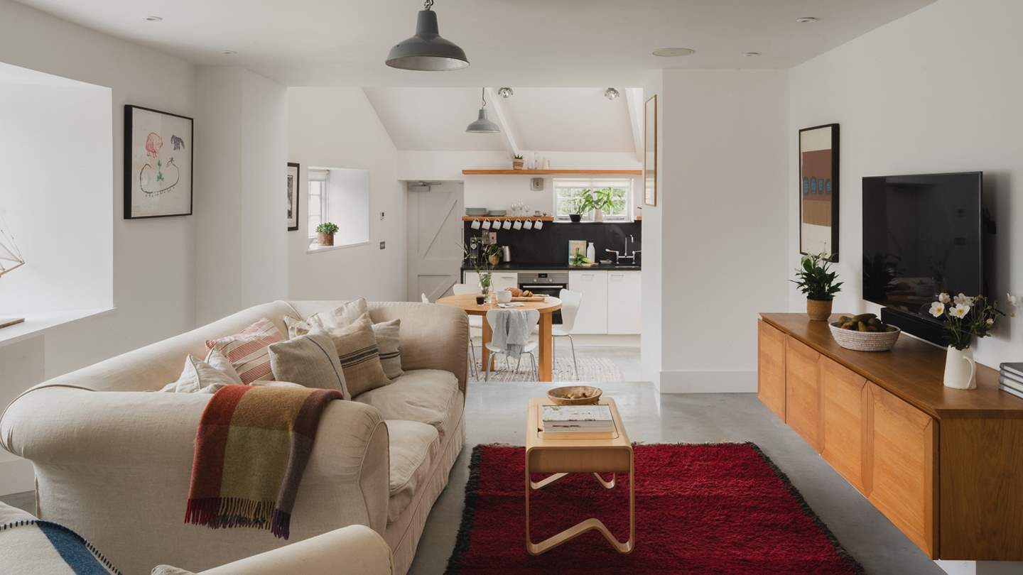 Uncover the open plan living room with steps down to the kitchen and dining space