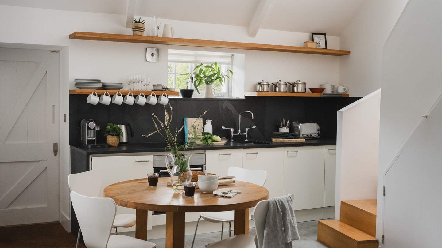 A round table sits in the middle of this space and seats up to four guests 