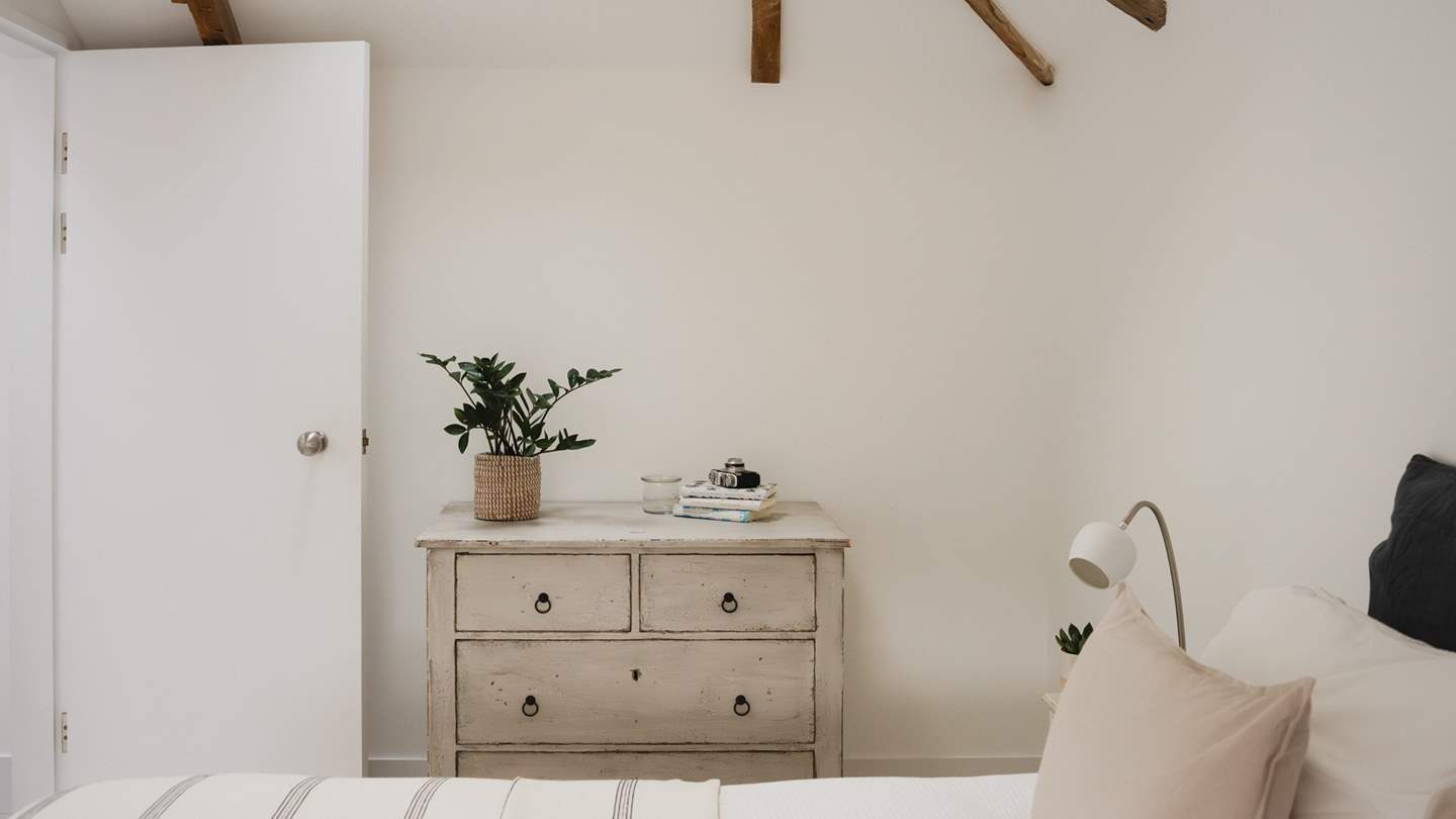 The vintage pine drawers keep your treasures safe and bring rustic warmth to this serene space 