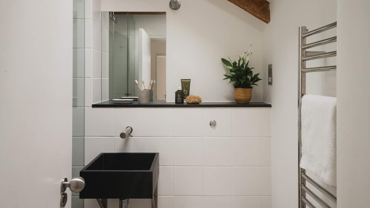 Altogether at Froe there are six bathrooms, two with luxurious baths and the rest with luxe  walk in showers 