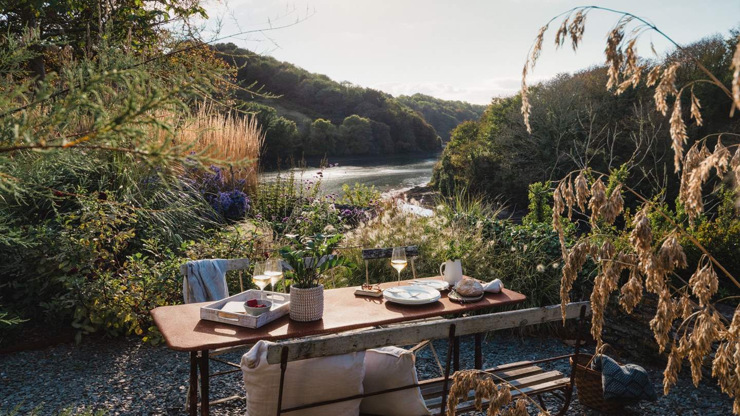 With it's own courtyard with slate chip pathways, abundantly planted borders and a dining table and chairs area overlooking the creek, a magical staycation backdrop awaits you