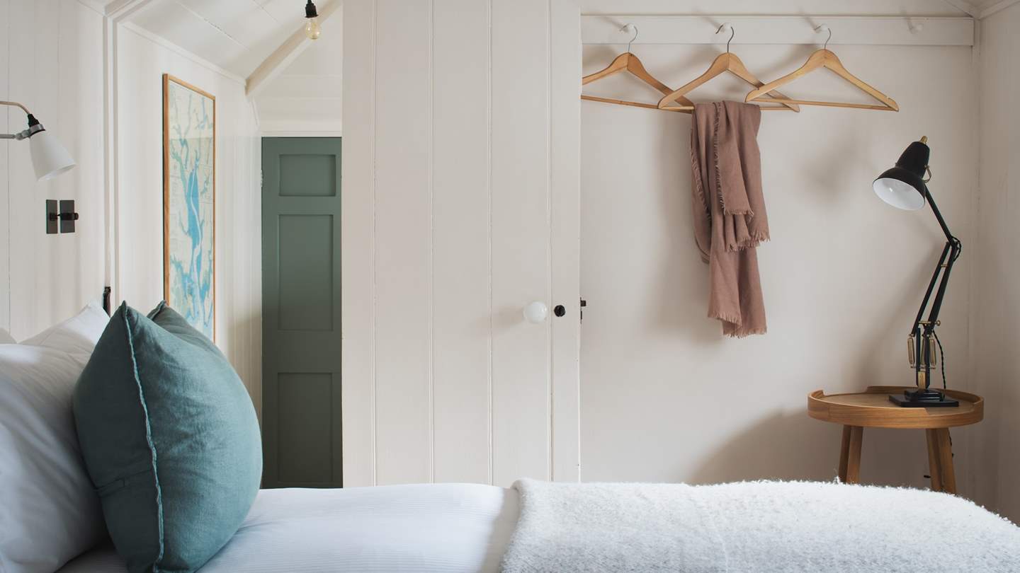 This smaller, charming bedroom is just lovely with original panelling and wood floors
