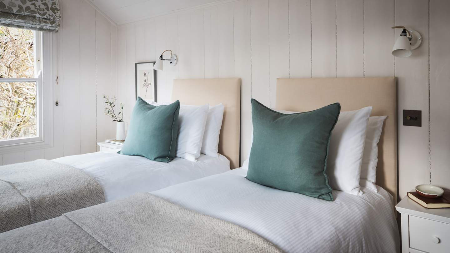 Views are over the garden, with a glimpse of the sea too