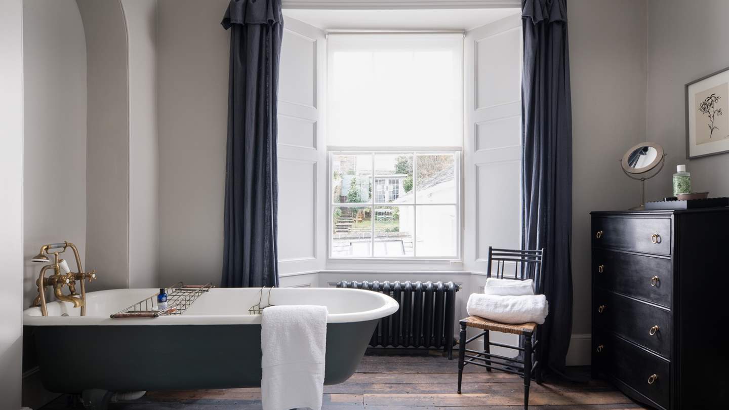 The impressive en suite to the master bedroom - perfect for long soaks - with views over the garden