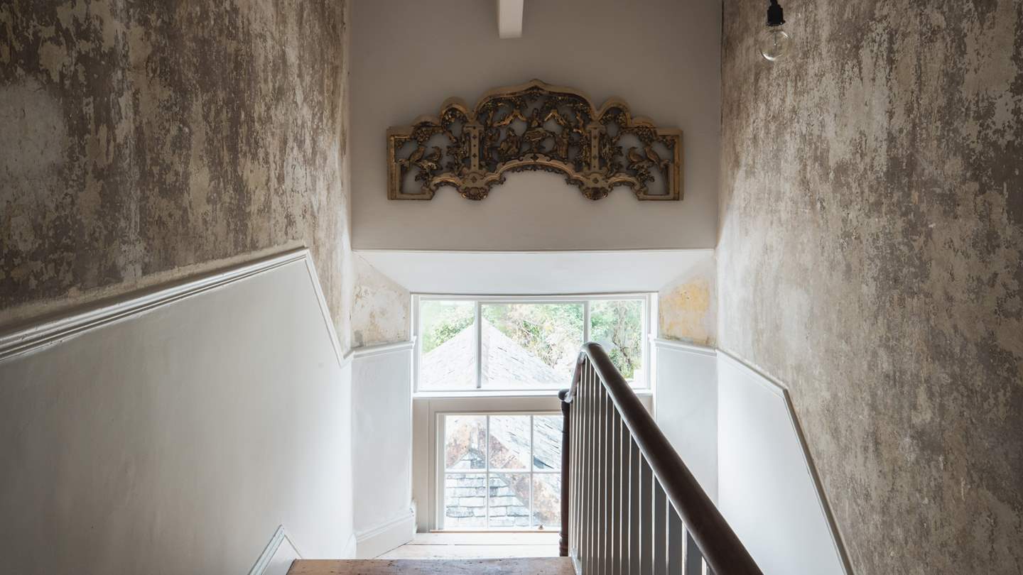 Stairs lead up to the top floor, where you'll find the second bedroom
