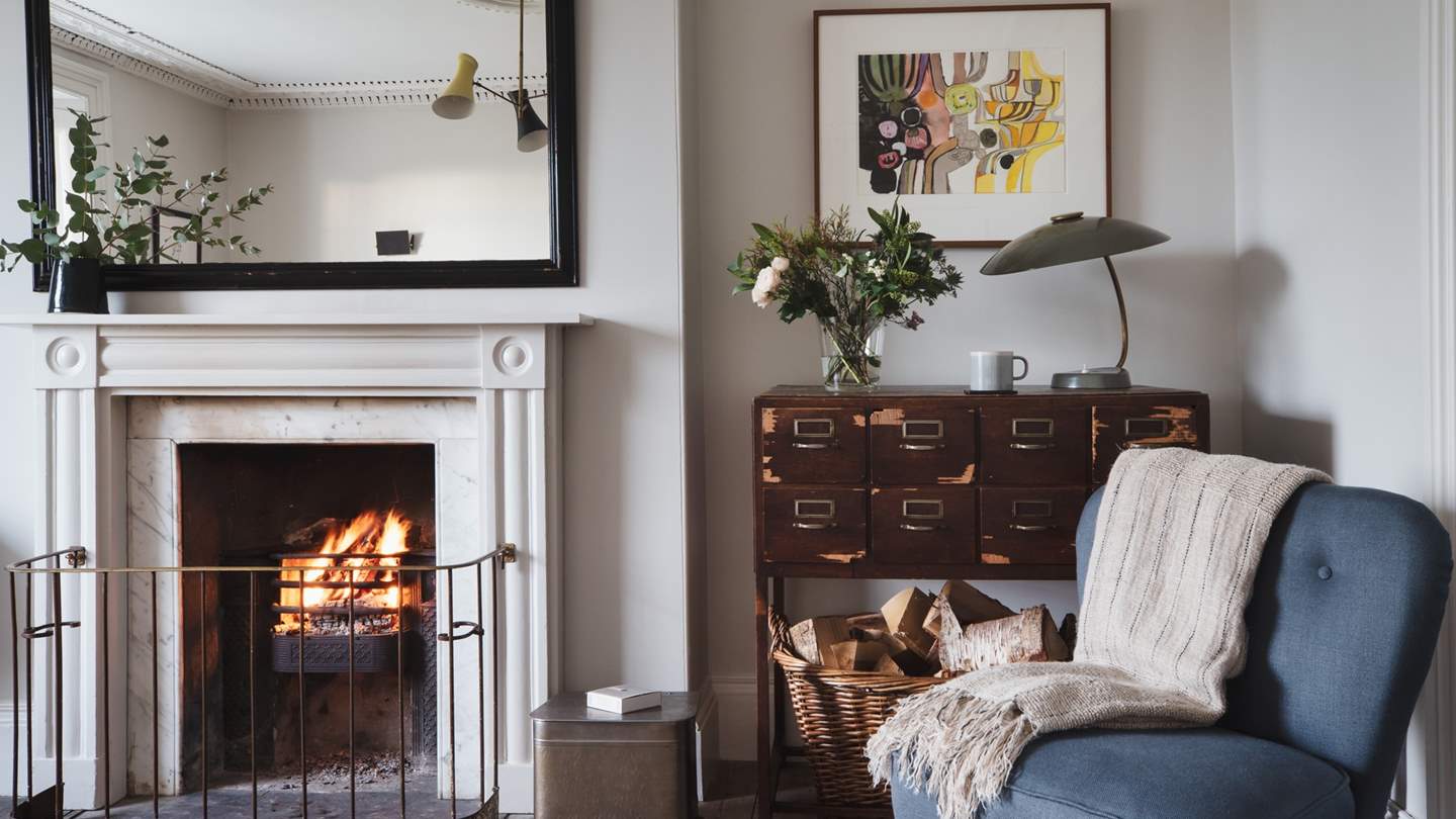 We just love the vintage furniture and the subtle hint of the sea with tones of blue and white