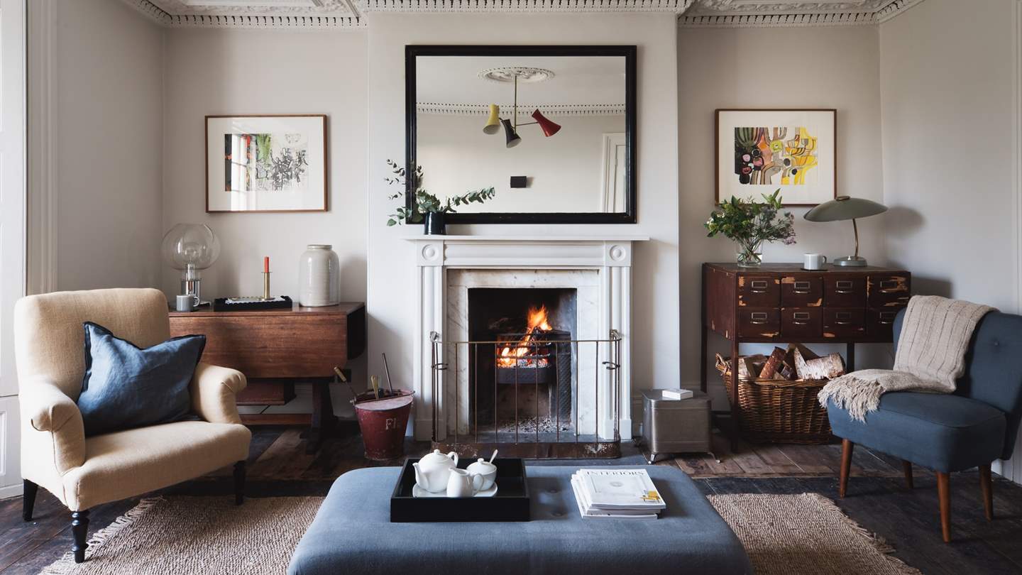The main sitting room offers views over the charming front garden towards the harbour and boasts a proper open fire