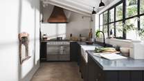 The traditional features contrast beautifully with the zinc-topped handmade Shaker kitchen