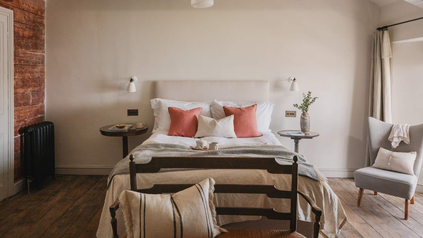 Spacious and in calming shades, this is a stunning bedroom to retreat to at the end of the day