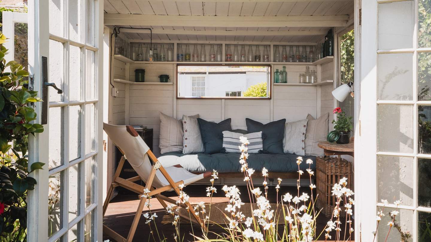 At the highest point of the garden lies a magical summer house, with doors that open out over exceptional views - just bliss!