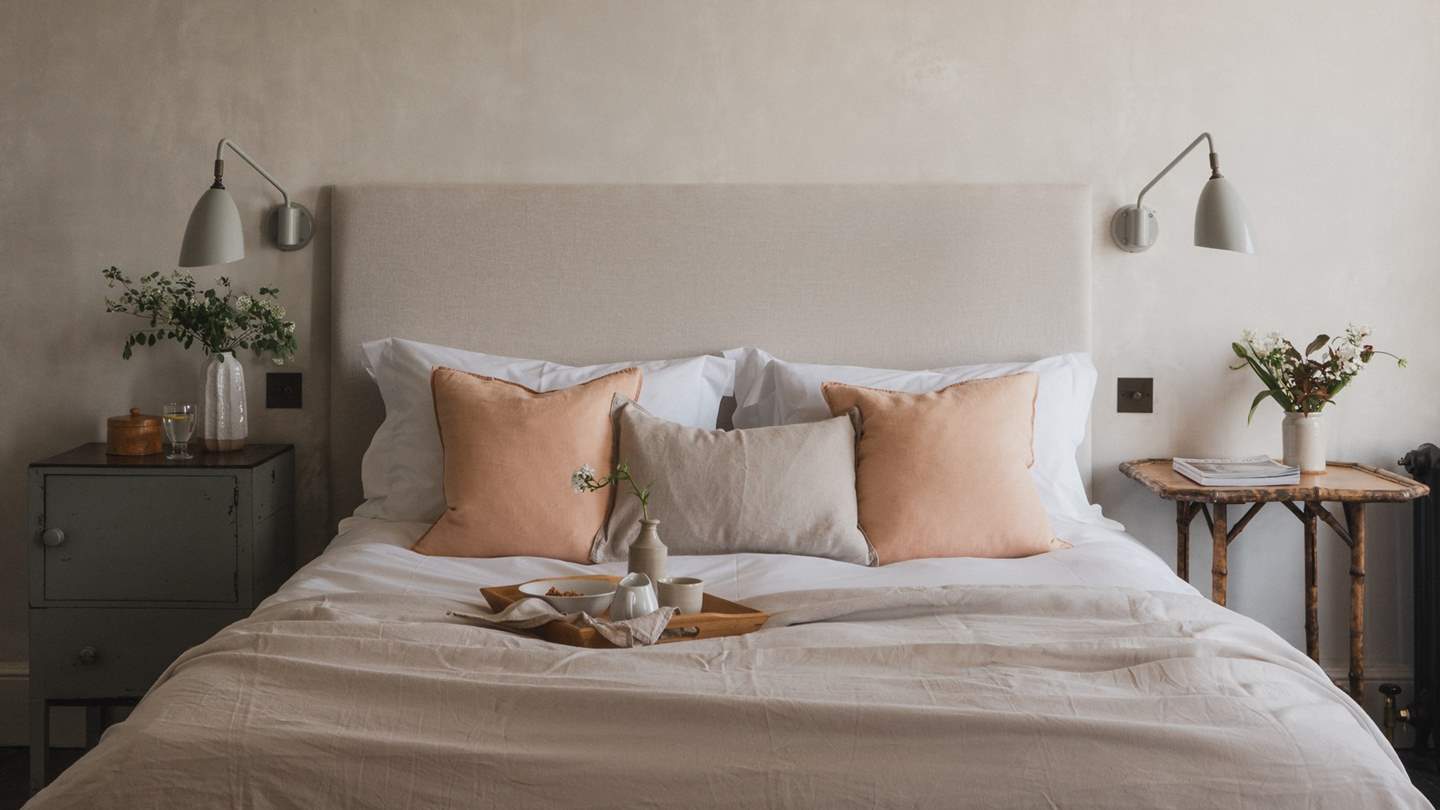 The gorgeous master bedroom, complete with original, exposed Georgian painted panelling by the windows