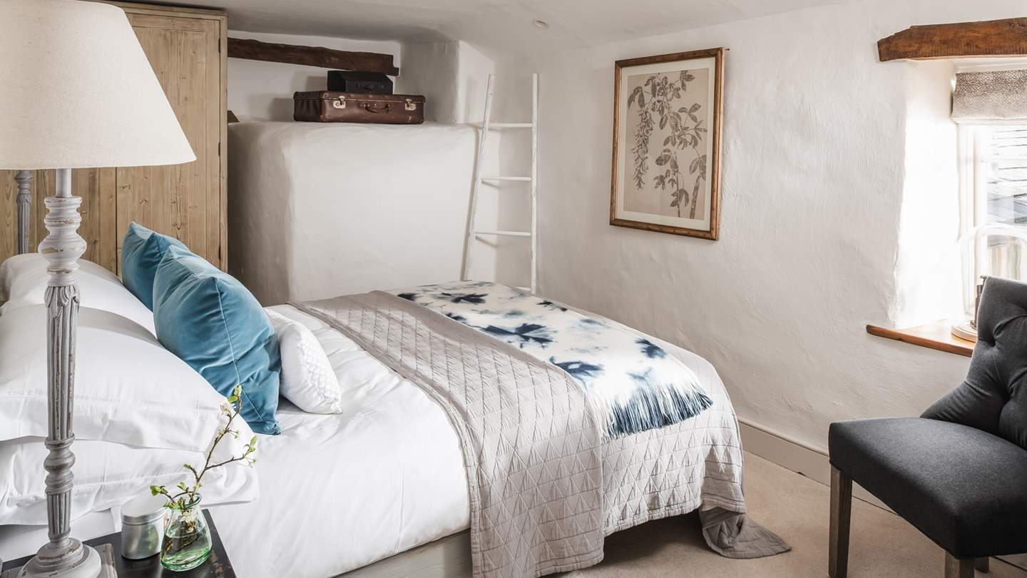 Apple Blossom House’s second bedroom is bathed in tranquil tones and features a French-inspired king-size be