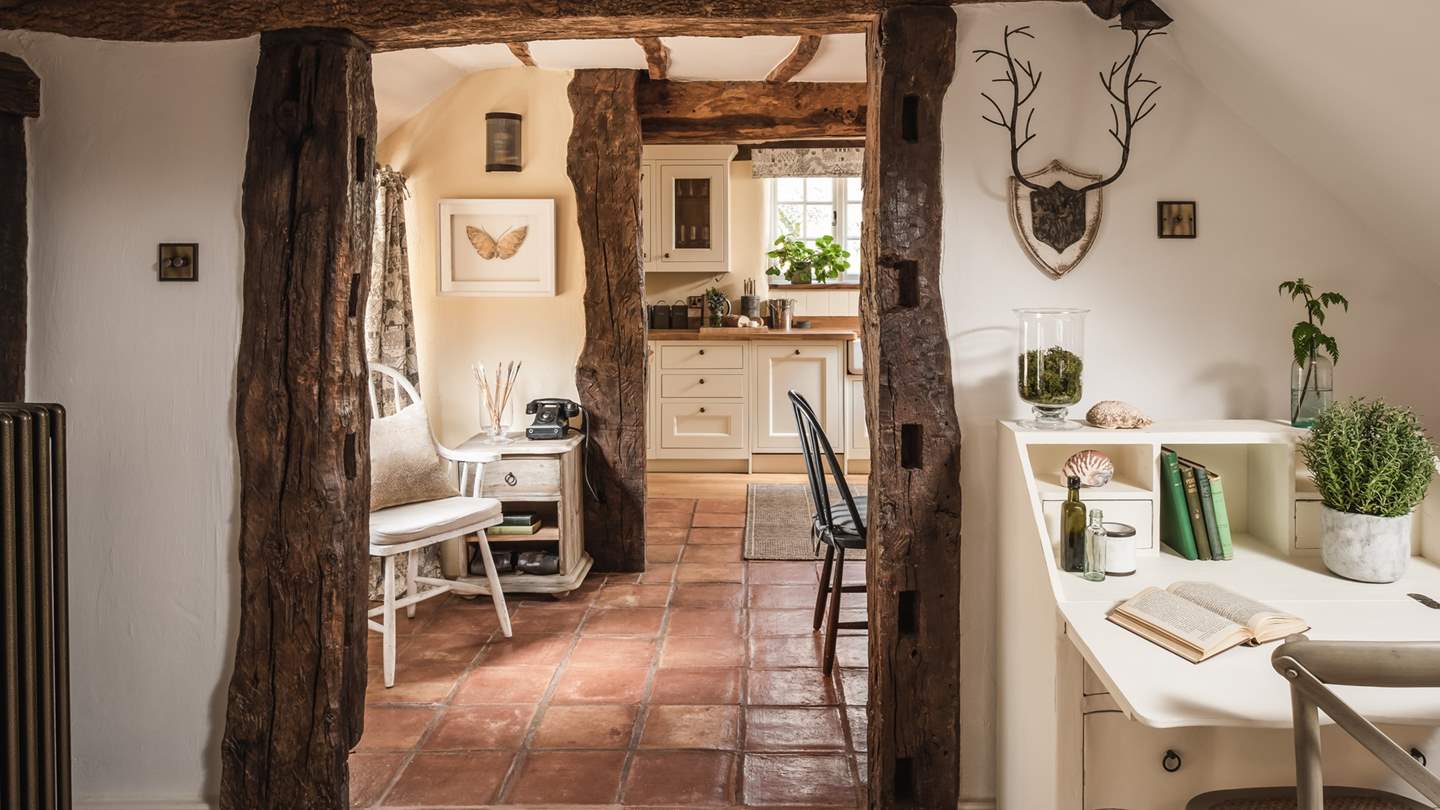 Seamlessly pairing period features with modern comforts, it is framed by rustic beams and adorned in soothing tones