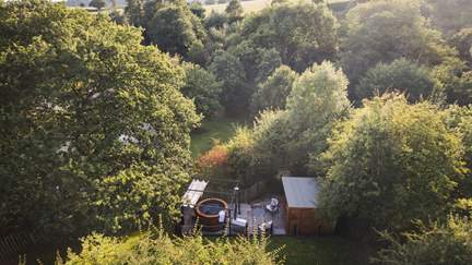 Nestled beneath the trees spend balmy summer days on the secluded sun-soaked terrace 