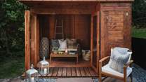 For those seeking a serene spot, there's a sweet summerhouse complete with a luxe outdoor sofa and two armchairs