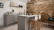The cosy kitchen with fabulous central island, the perfect spot for breakfast and planning your day ahead