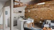 Open plan living awaits, with a vaulted ceiling, exposed beams and modern rustic interiors...