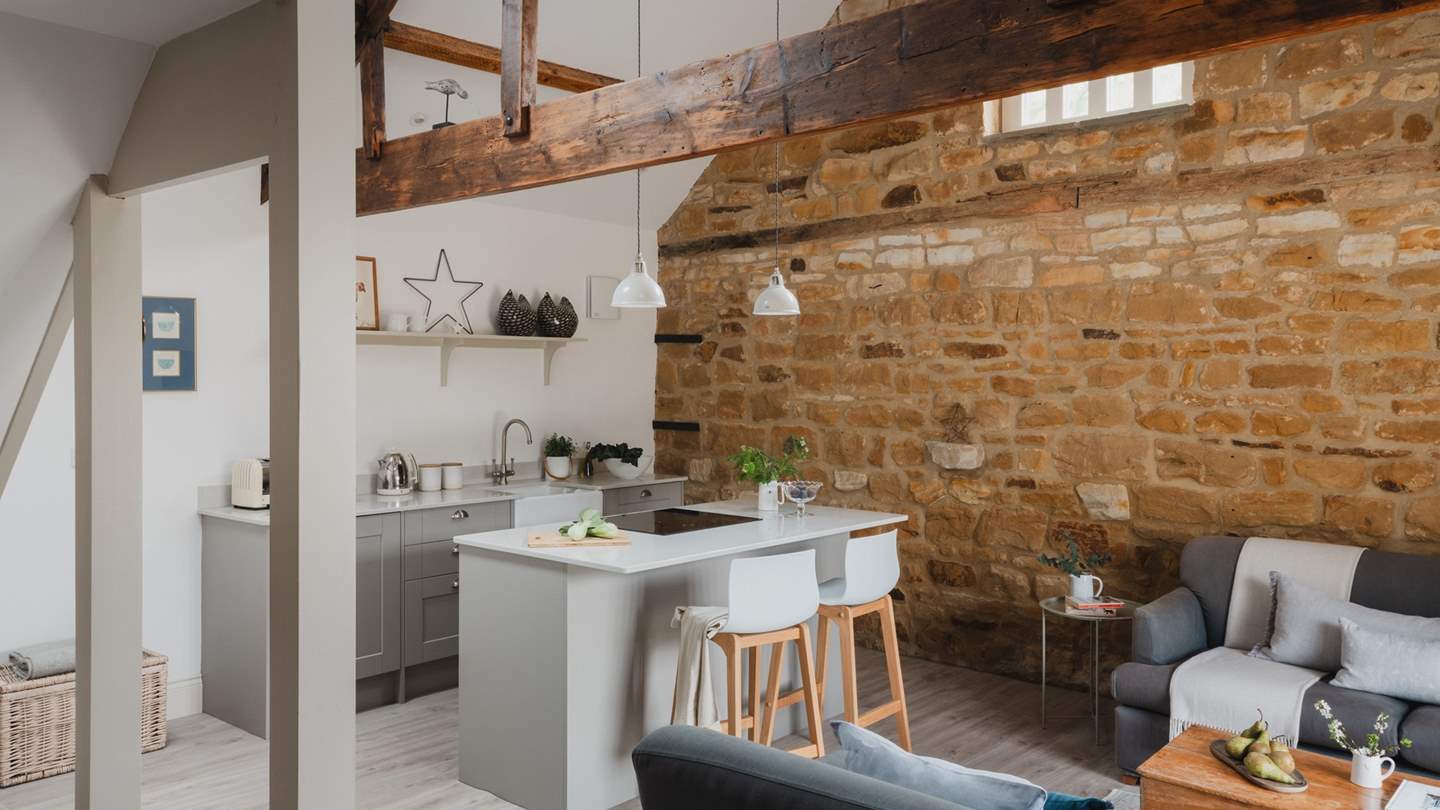 Open plan living awaits, with a vaulted ceiling, exposed beams and modern rustic interiors...