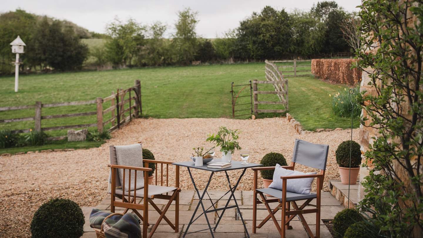 The pretty outside terrace lies to the front of The Swallow's Nest, made for alfresco dining overlooking rolling countryside...