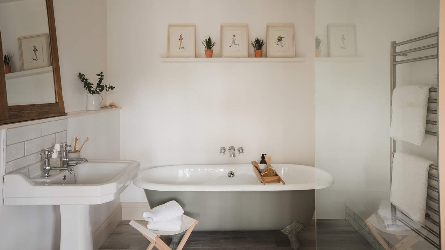 Slip softly into bubble-topped soaks within the free-standing roll top bath...