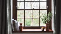 Catch glimpses of country scenes from the window in this pretty room