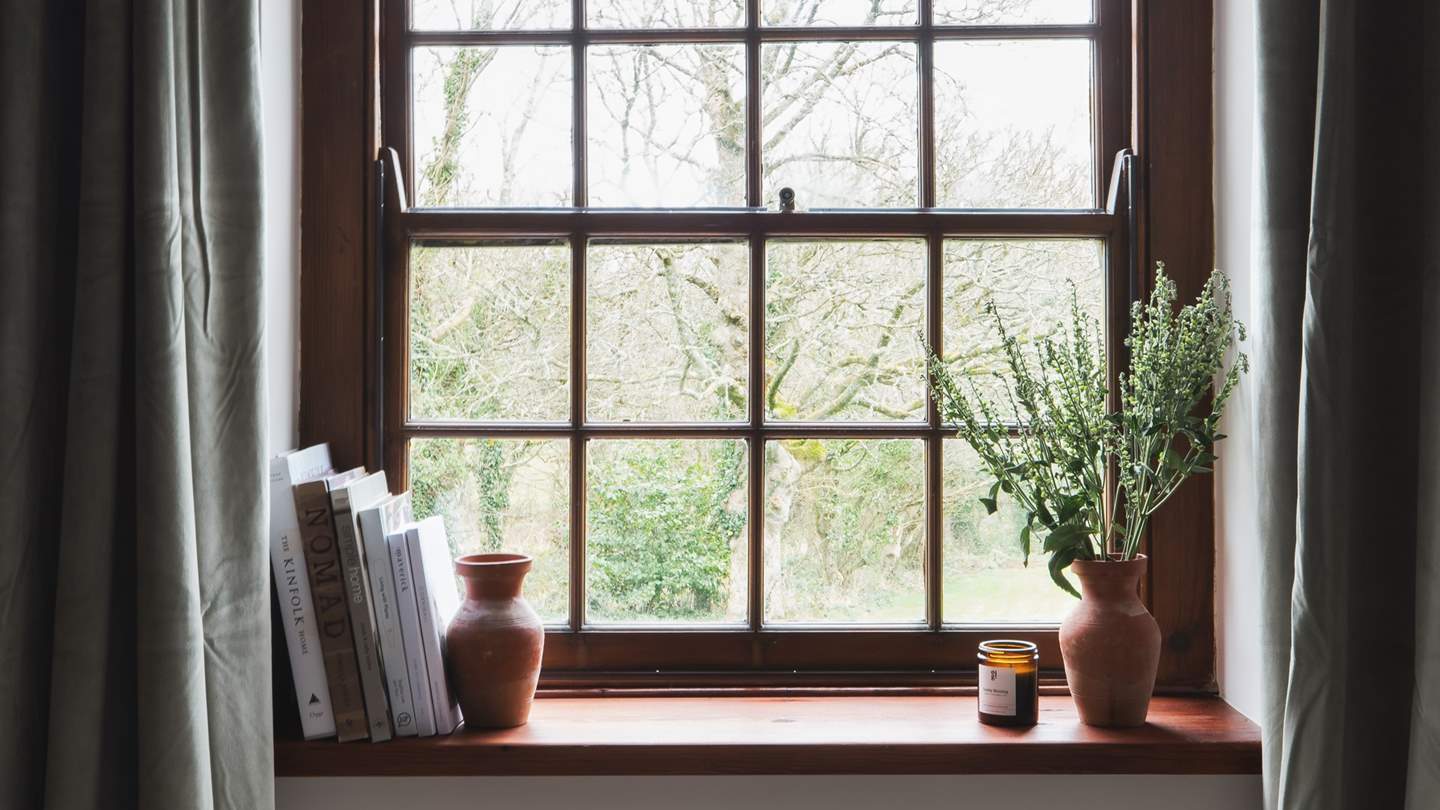 Catch glimpses of country scenes from the window in this pretty room