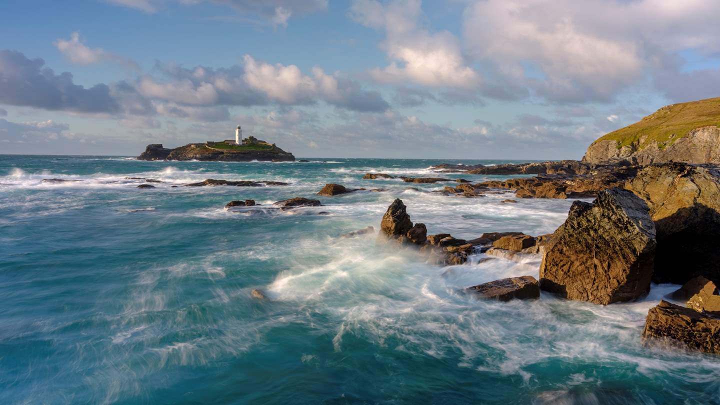 The huge sandy beach of Gwithian, with Godrevy Lighthouse in the background, is the perfect spot to blow away the cobwebs