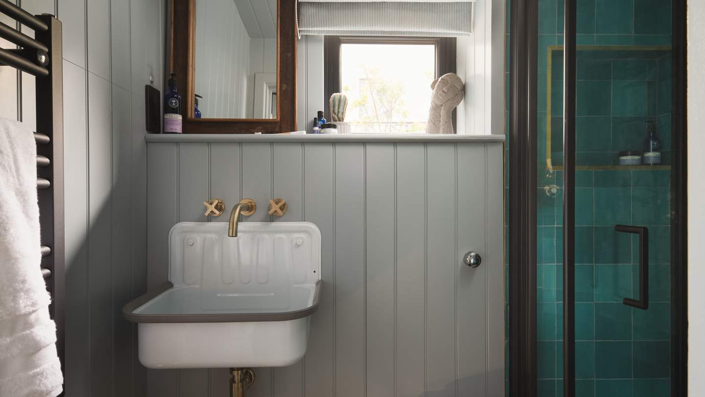 We love the turquoise tiles in the shower...