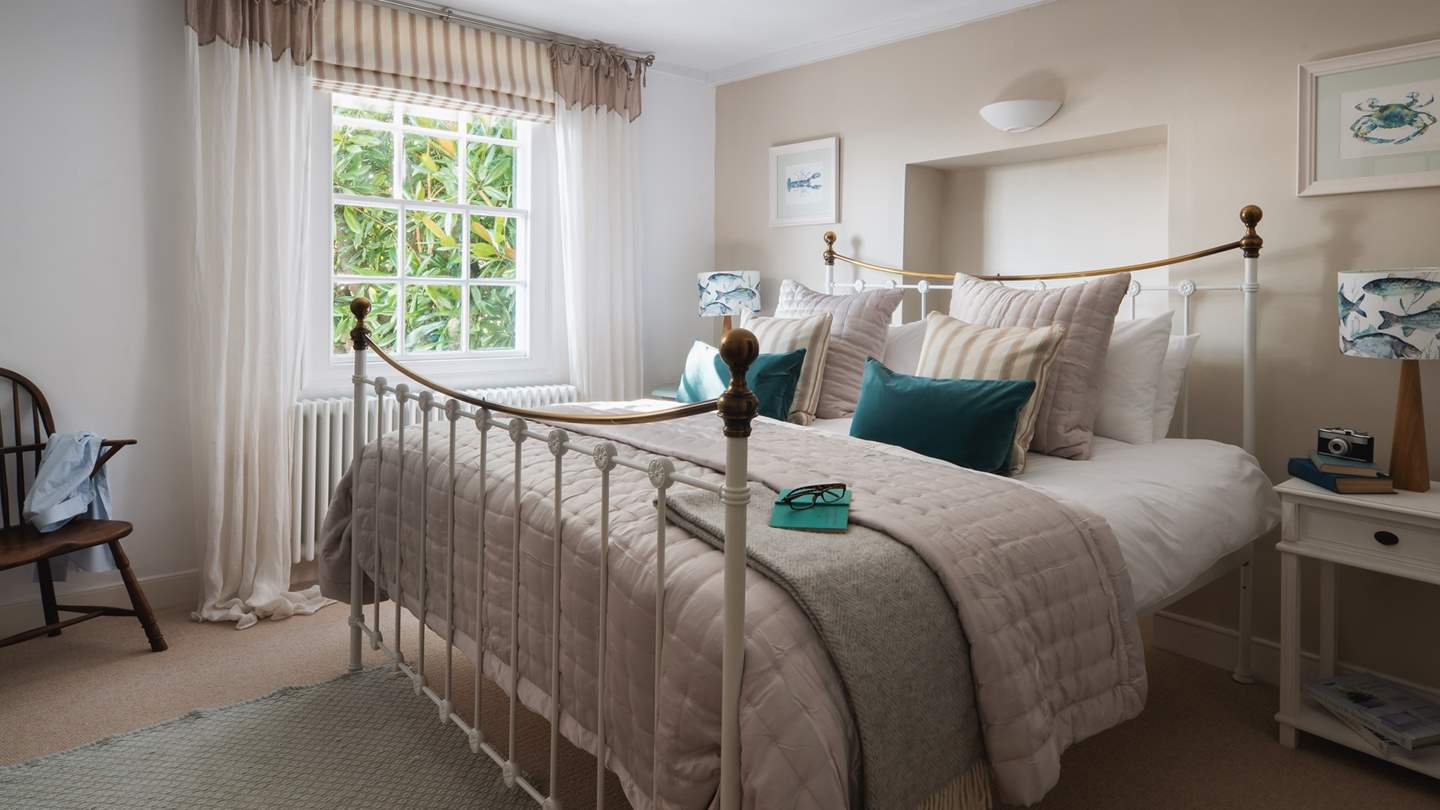 The 'Blue' room, with a sumptuous king size bed, dressed in calming hues