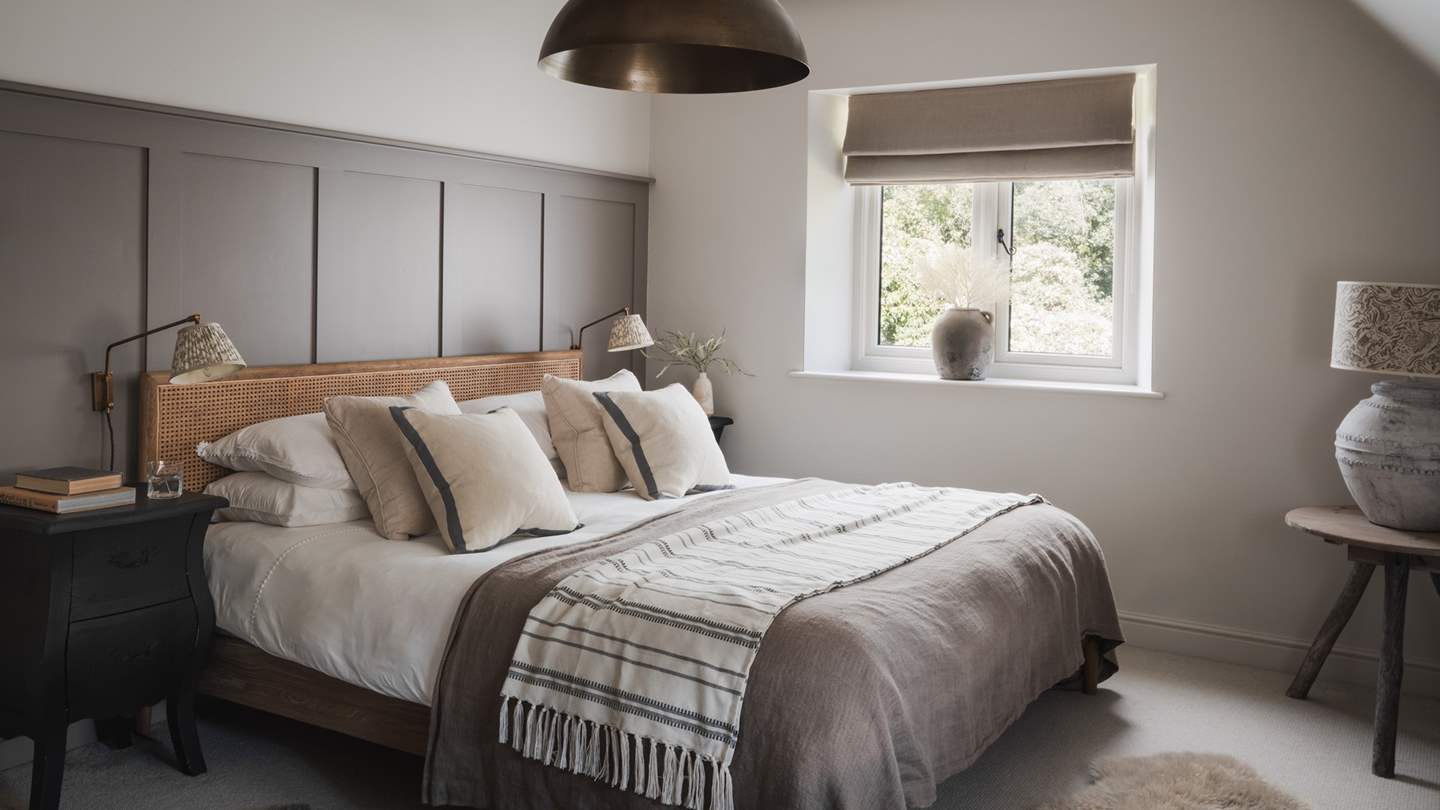 Daydream beneath the exposed beams and stunning feature light, or cosy up in the darling armchair for a moment of quietude