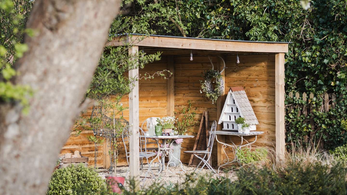 Sip morning coffee beneath the blossoming trees