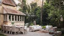 To the rear of the retreat lies a gorgeous garden with sun-soaked terrace leading from the orangery