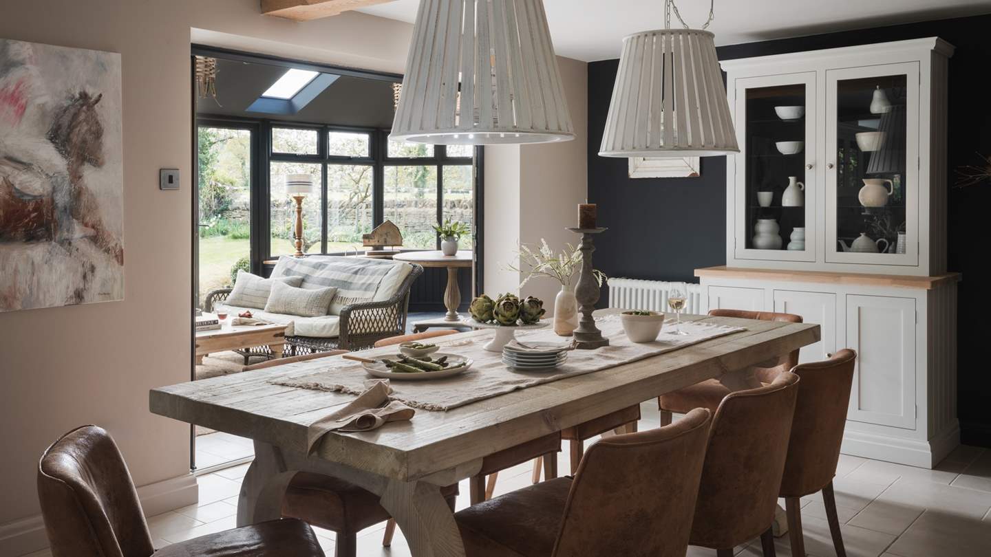 The farmhouse style dining table comfortably seats ten people, just made for gathering together to enjoy pared-back brunches and beautiful banquets