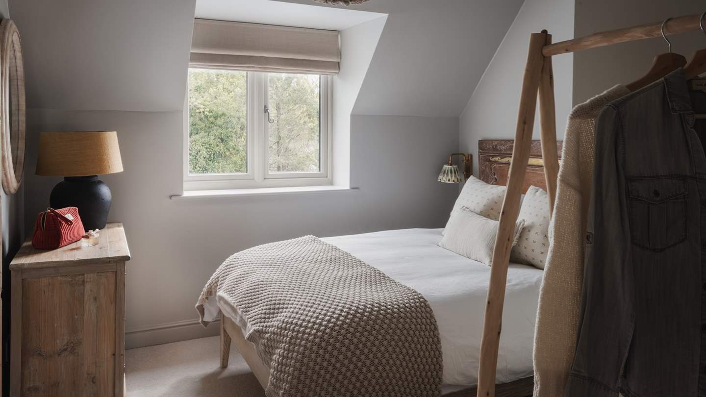 We just adore the unique wooden hanging space, offering an aesthetic alternative to storing away your gorgeous garments!