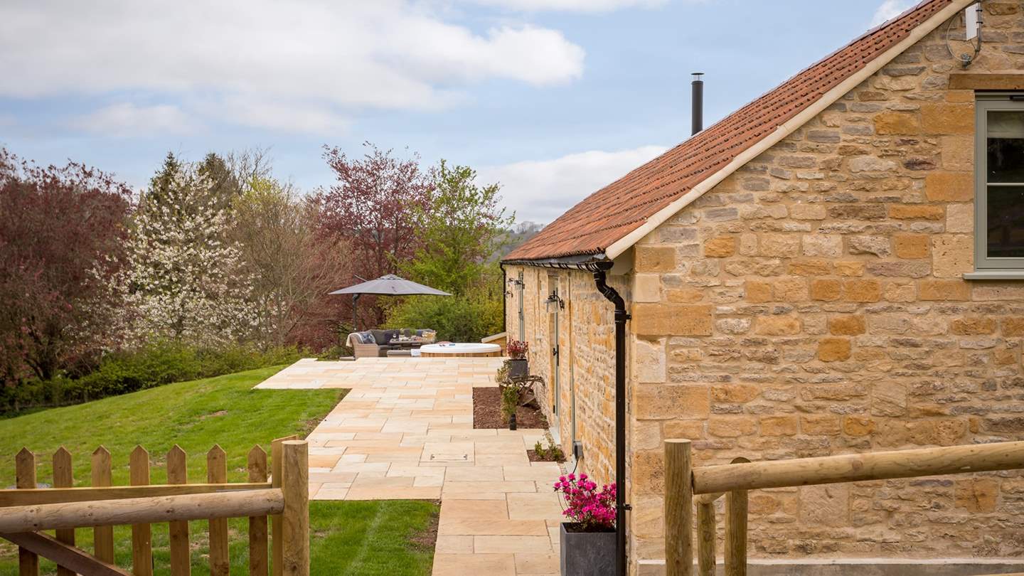 Step through the gate, where the gorgeously golden stone barn awaits....