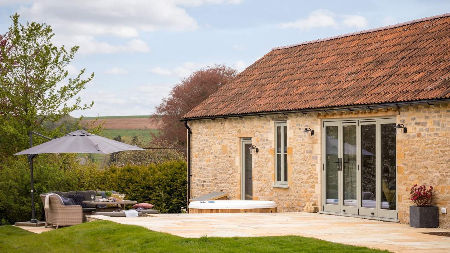 The spacious patio is made for lazy afternoons in the sunshine